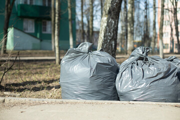 Garbage. Cleaning area. Black Garbage Bags.