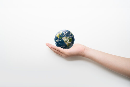 globe blue on hands in white background, earth in adult hands , earth day, world day, energy saving concept, Elements of this image furnished by NASA.
