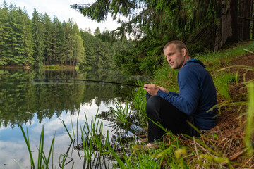 Shore fishing catching fish fishing rod equipment copy space summer activity, outdoors vacation travel, active lifestyle