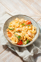 Fettuccine pasta with shrimp, tomatoes and herbs