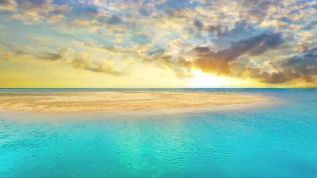 Turquoise waters caress a tropical island's sandy beach at sunrise, beckoning relaxation and wanderlust filled travels