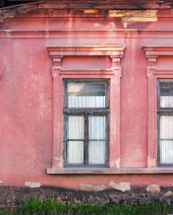 Fototapeta na wymiar retro windows on the grunge facade. traditional old european architecture