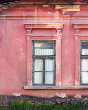 retro windows on the grunge facade. traditional old european architecture