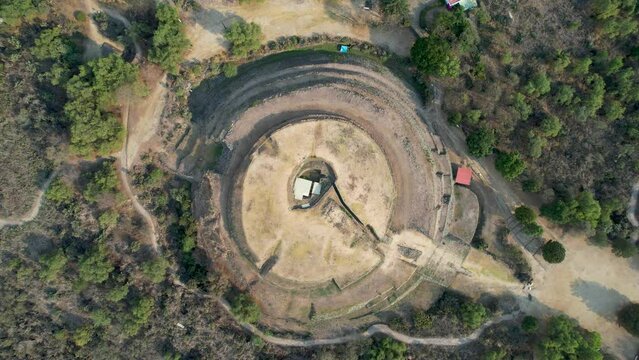 rotated drone shot of core Cuicuilco pyramid in Mexico city at morning