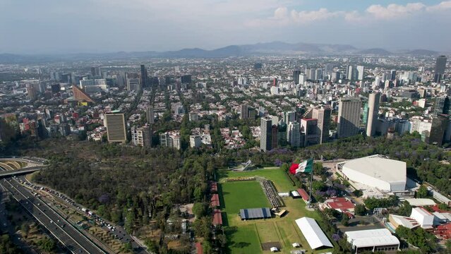 drone shot of barrio de polanco and the bosque de chapultepec on a polluted day in mexico city