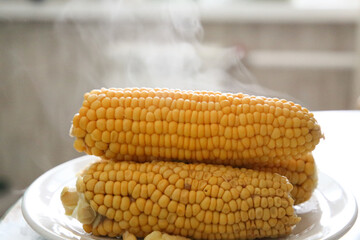 hot boiled corn steam comes out of it