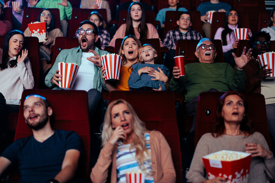 Frightened Audience In Movie Theater.