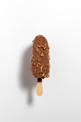 Ice cream covered with chocolate and almonds isolated on white background