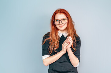 Woman with long red hair in glasses. Teacher. Education, teaching. Librarian.