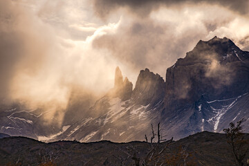 Dramatic clouds and light mood over the mountains at Torres del Paine massif, Chile