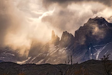 Fototapete Cuernos del Paine Dramatic clouds and light mood over the mountains at Torres del Paine massif, Chile