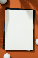 Blank white magazine cover mockup on brown background