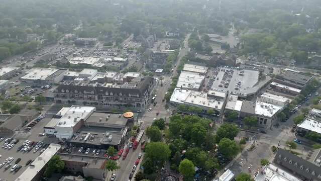 Downtown Plymouth, Michigan with drone video moving in wide shot.