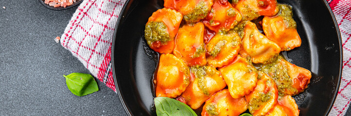 pesto sauce ravioli , meat, tomato sauce meal food snack on the table copy space food background rustic top view