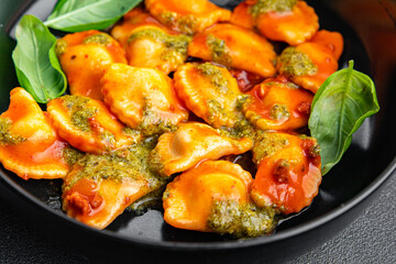 pesto sauce ravioli , meat, tomato sauce meal food snack on the table copy space food background rustic top view