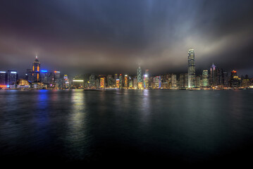 Hong Kong's water front at night and foggy sky 
