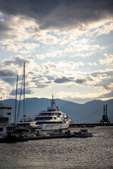Fototapeta na wymiar luxury yacht in the harbor at dusk, early summer