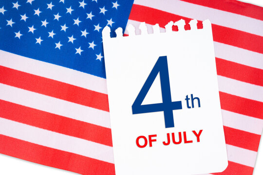 The 4 th July calendar with part of an American flag on white background.USA Independence Day date.