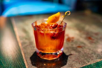 alcohol cocktail in a glass stands on a table in a bar or restaurant