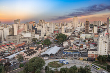 Naklejka na ściany i meble Campinas, Sao Paulo, Brazil. June 23, 2023. Aerial image of three central districts of Campinas: Vila Itapura, Cambuí and Jardim Guanabara. Sunset and blue sky.