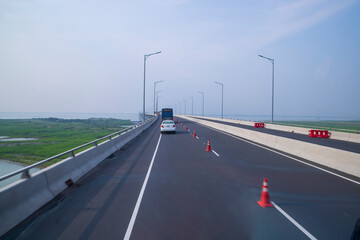 Fototapeta premium Padma Bridg Highway asphalt with blue sky Background. Perspective view