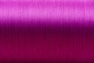 Closed up of pink color of thread textured background (Focus at center of picture)