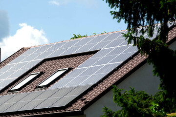 Installing a Solar Cell on a Roof. Solar panels on roof. Historic farm house with modern solar panels on roof and wall. High quality photo