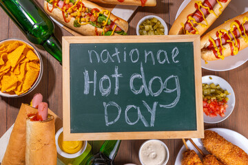 National Hot Dogs day background, hotdog summer party festival foods, Various type of traditional hot dogs - french, corn dog, classic. mexican loaded hotdog, with snack, beer bottles and sauces
