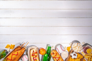 Traditional sport stadium foods and beer background, Set of various baseball, basketball, football fans and stadium snacks, chips, sauces, hot dogs with beer bottles and fan accessories 