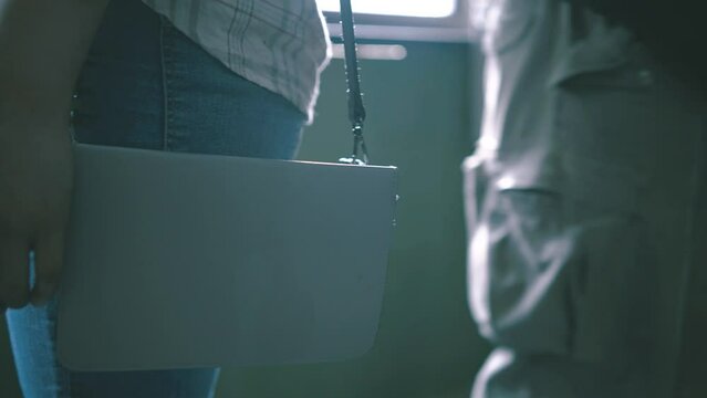 A woman does not suspect that her phone was stolen by a sly pickpocket. The thief stole her cell phone from the bag