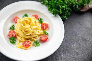 fresh tomato pasta tagliatelle and parmesan cheese meal food snack on the table copy space food background rustic top view