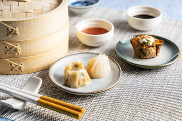 Dim sum steamed in a bamboo basket.