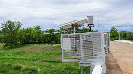 Close up view of water level a measurement and flood warning system installed on the local bridge closed to a community                               