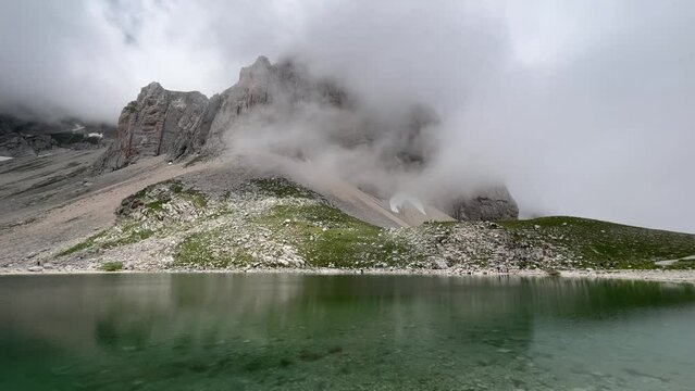 Dark cloud over Pilato lake,  between the regions Umbria and Marche, in the Monti Sibillini mountain natural park