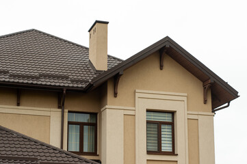 Modern roofing materials on the roof of the house, metal tiles