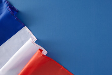 Bastille Day festivities concept. Top view composition of french flag on blue background with empty...
