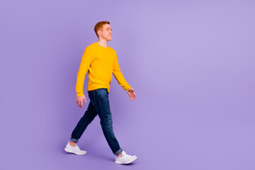Fototapeta na wymiar Full size photo of positive cheerful man have free time walk wear casual style clothes isolated over purple color background