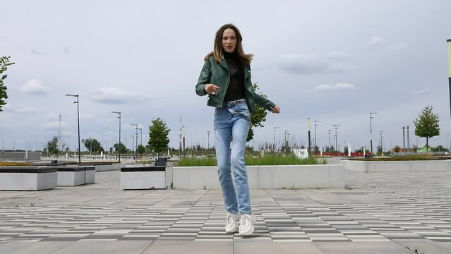 Shuffle dencer. Young beautiful girl dancing modern dance on the street