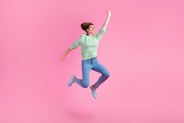Fototapeta na wymiar Full body photo of young girl jumping dressed stylish outfit isolated on purple color background