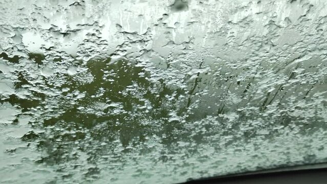 Hail storme on the car window