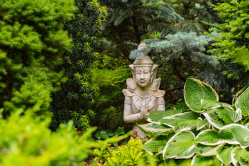 beautiful indian statue green garden