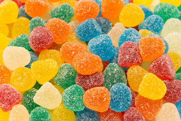 Assorted colorful gummy candies isolated on a white background.