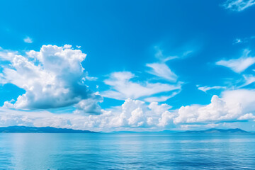 Fototapeta premium Calming summer natural marine blue background . sea and sky with white clouds photography