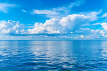Naklejka na ściany i meble Calming summer natural marine blue background . sea and sky with white clouds photography