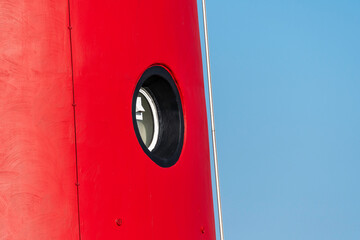 Detail of the cast iron red lighthouse of Schiermonnikoog after a paint job, Friesland, The...