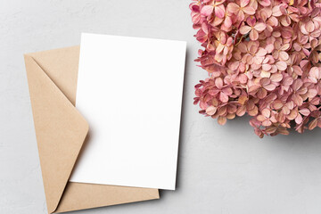 Blank wedding invitation or greeting card mockup with hydrangea flowers © nikavera