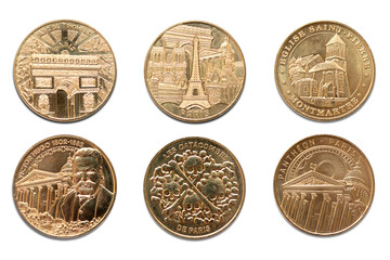 Paris, France. Paris coins. Tourist attractions and celebrities engraved in golden metal. Arc de Triomphe, Eifel Tower, Montmartre, The Catacombs, Victor Hugo and Pantheon. Transparent background. 