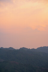 silhouette and panorama layer of mountain with sunset background