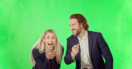 Business people, surprise and watching entertainment on green screen pointing to you against a studio background. Businessman and woman shocked or wow in good news, prize or promotion on mockup space