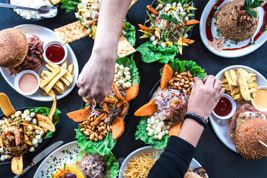 Overhead View Of A Group Of People Celebrating And Eating In A Peruvian Restaurant